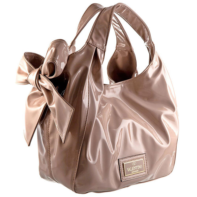 Product Shot Of A Patten Leather Beige Handbag